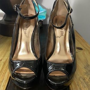 Steve Madden black ankle strap pumps.